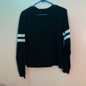 black sweater with stripes on the sleeve